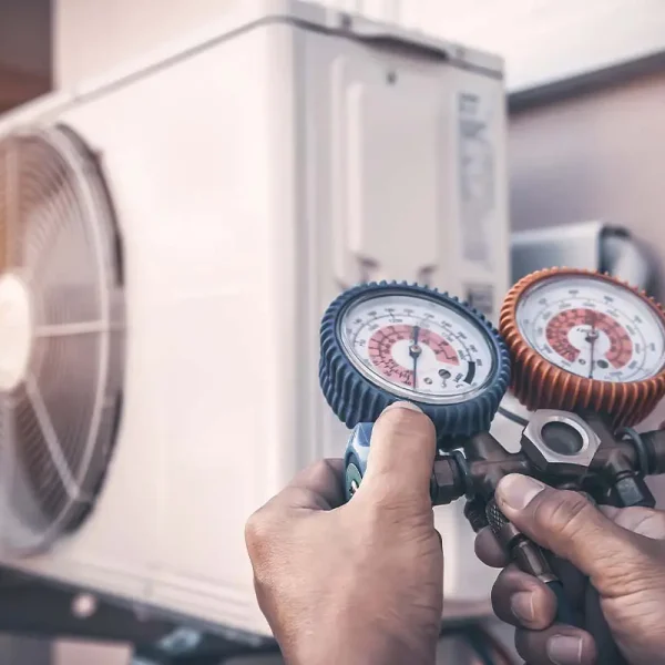 HVAC-Contractor-Insurance-HVAC-Mechanic-Using-Pressure-Gauge-Equipment-for-Home-Air-Conditioner-After-Maintenance-and-Checking-Outdoor-Air-Compressor-Unit HVAC-Contractor-Insurance-HVAC-Mechanic-Using-Pressure-Gauge-Equipment-for-Home-Air-Conditioner-After-Maintenance-and-Checking-Outdoor-Air-Compressor-Unit
